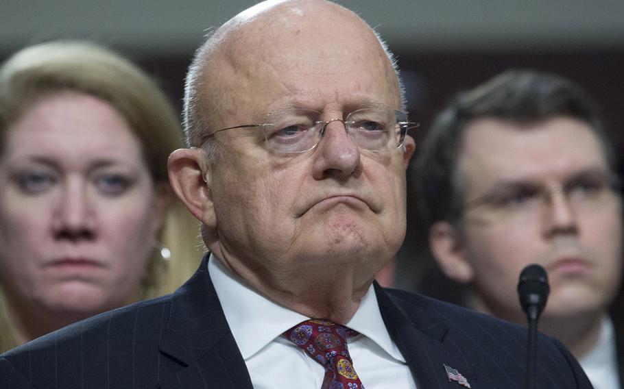 Director of National Intelligence James R. Clapper, Jr., center, listens to opening statements during a Senate Armed Services Committee hearing on cybersecurity, Jan. 5, 2017, on Capitol Hill.