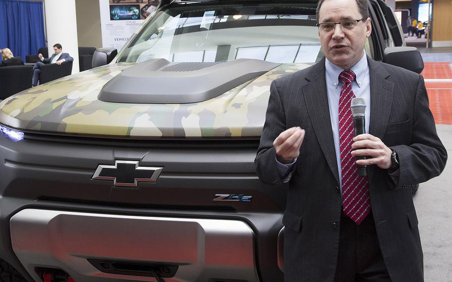 Dr. Paul Rogers, director of the U.S. Army's Tank Automotive Research, Development and Engineering Center (TARDEC), stands next to the ZH2 Fuel Cell Electric Vehicle as he talks to reporters at the Washington Auto Show, Jan. 26, 2017.