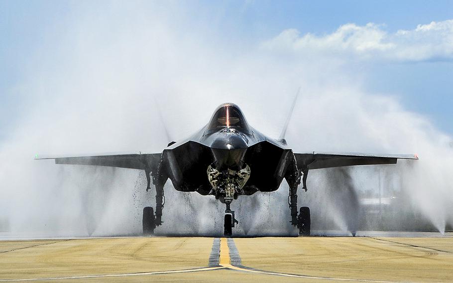 Lt. Col. Christine Mau, 33rd Operations Group deputy commander, navigates an F-35A through the "bird bath" at Eglin Air Force Base, Fla., on May 5, 2015. The Pentagon announced Friday, Jan. 27, 2017, that Defense Secretary Jim Mattis has ordered reviews of Lockheed Martin's F-35 Joint Strike Fighter and plans for Boeing to build new Air Force One presidential aircraft.