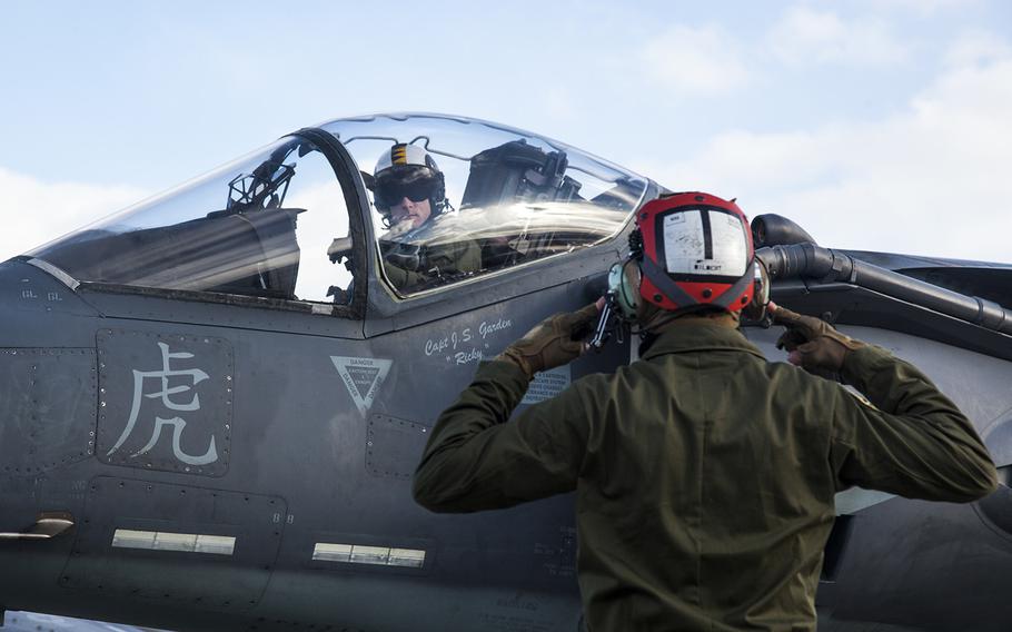 A U.S. Marine Corps AV-8B Harrier with Marine Attack Squadron 542 waits on the flight line before a routine inspection during the Aviation Training Relocation Program at Chitose Air Base, Japan, Dec. 7, 2016. 