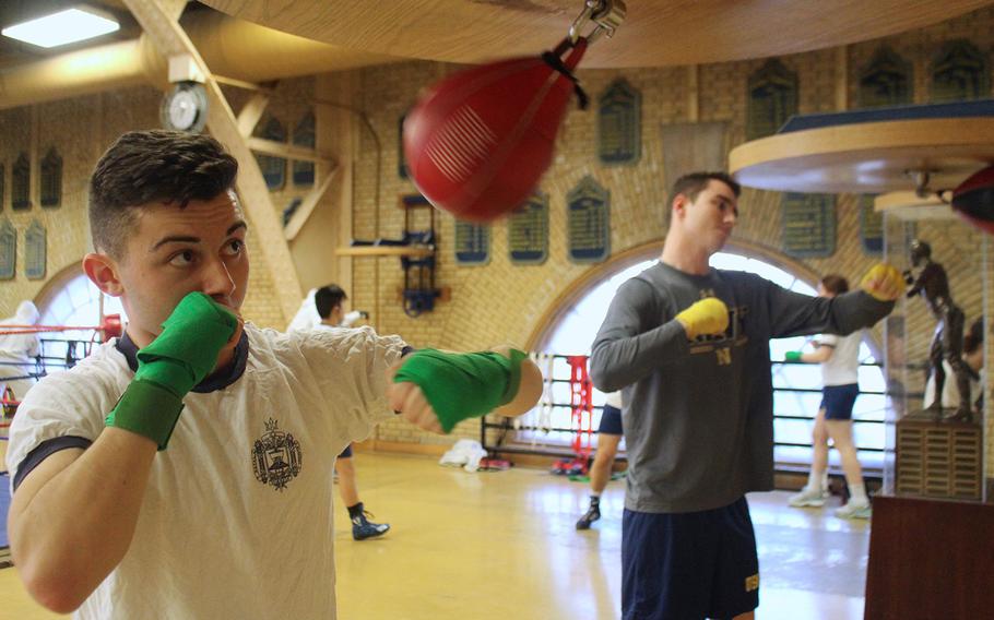 United States Naval Academy juniors Nathaniel Fields, left, and Jordan Hay, right, practice on the speed bag before the semifinals of the Brigade Championships on the Annapolis campus. Boxing started at the Naval Academy in 1865.