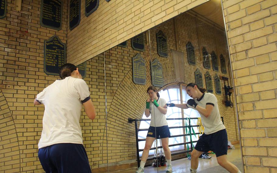 Senior Katherine Marapese, right, and Junior Katherine Kinnear shadowbox while prepping for the semi-finals of the Brigade Championships at the United States Naval Academy in Annapolis.  Boxing started at the Naval Academy in 1865.