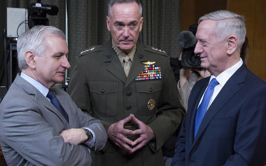 Secretary of Defense Jim Mattis, right, talks with Sen. Jack Reed, D-R.I., and Joint Chiefs of Staff Chairman Gen. Joseph Dunford before a Senate Appropriations Committee hearing on Capitol Hill, March 22, 2017.