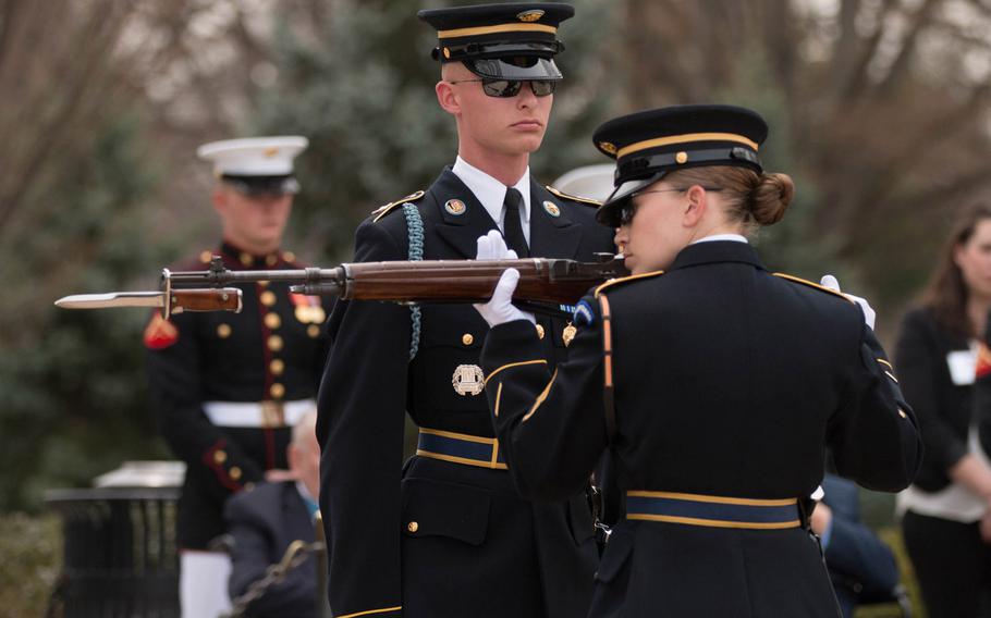 Soldiers with the U.S. Army's 3rd Infantry Regiment "The Old Guard" conduct a changing of the guard inspection at the Tomb of the Unknown Soldier at Arlington National Cemetery on Saturday, March 25, 2017.