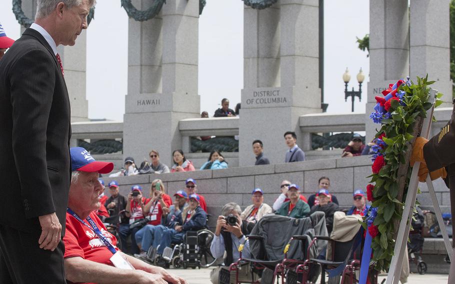 Representing the Kansas Honor Flight, Congressman Roger Marshell and World War II, Korea and Vietnam veteran Ewin Aley place a wreath during the Battle of the Coral Sea 75th Anniversary at the World War II Memorial in Washington, D.C., May 4, 2017. 