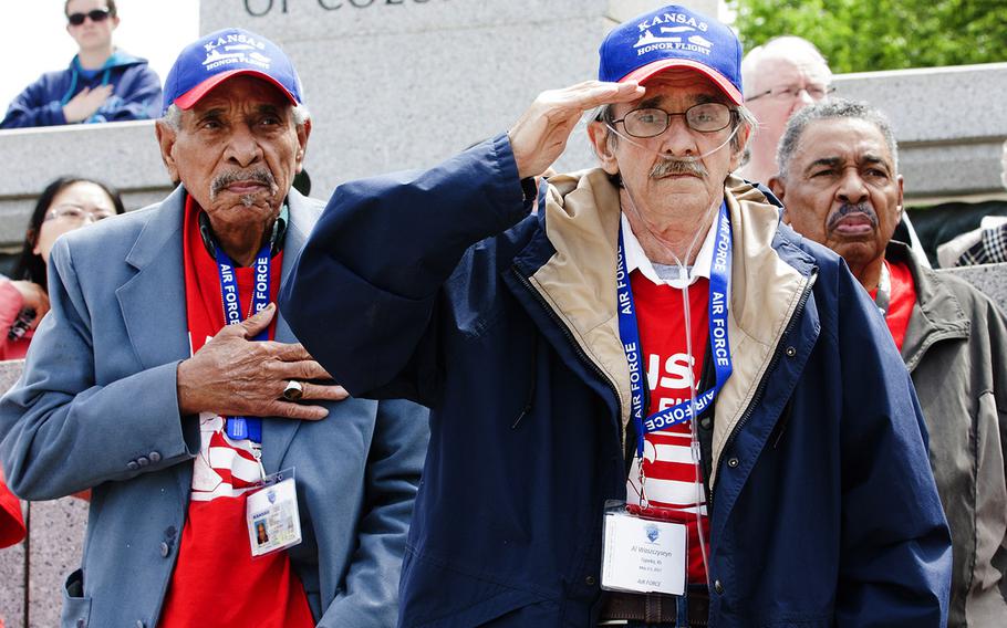 Al Waszczyseyn, foreground, and other Air Force veterans with the Kansas Honor Flight salute at the start of the Battle of the Coral Sea 75th Anniversary Commemoration at the World War II Memroail in Washington, D.C., on May 4, 2017.