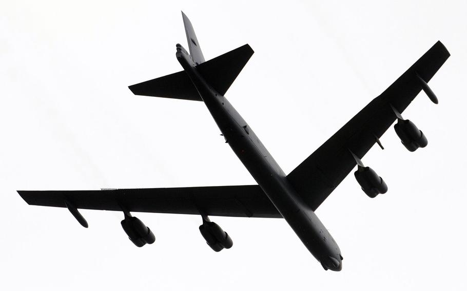 A B-52 bomber roars over Arlington National Cemetery on Sunday, May 28, 2017.