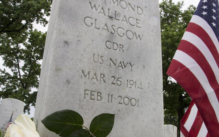 A rose and a flag adorn an Arlington National Cemetery grave in preparation for Memorial Day, Sunday, May 28, 2017.