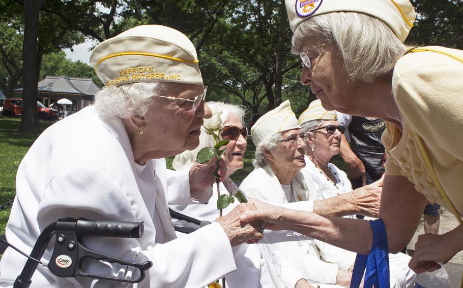 Gold Star Mother Emogene Cupp greets someone who stopped as they passed by on Memorial Day, May 29, 2017.