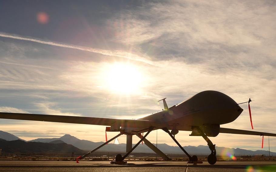 An MQ-1 Predator sits on the flight line on Dec. 8, 2016, at Creech Air Force Base, Nev. U.S.-led coalition troops where on patrol east of Tanf, Syria, when a drone similar in shape and size to a Predator dropped an unidentified munition on the troops on Thursday, June 8, 2017. 