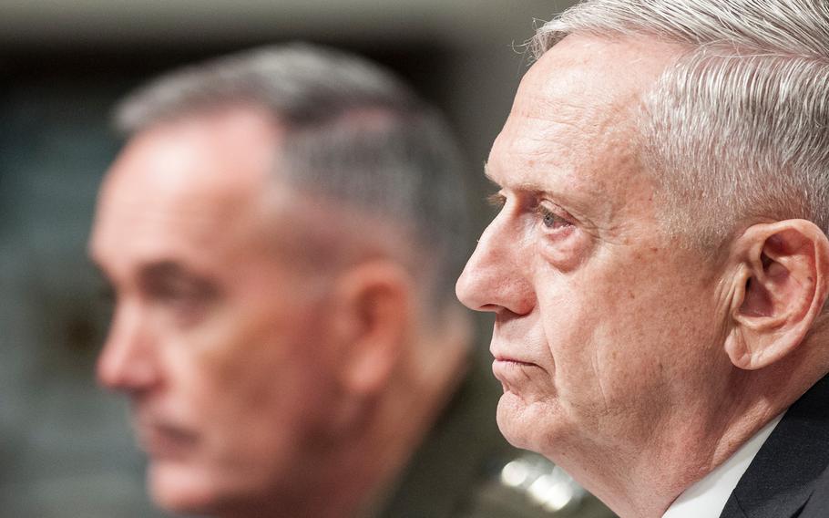 Defense Secretary Jim Mattis listens to pointed questions about Defense spending and U.S. military strategy in Afghanistan directed towards him by Sen. John McCain, during a Senate Armed Services Committee hearing on Capitol Hill in Washington, D.C., on Tuesday, June 13, 2017. At left is Chairman of the Joint Chiefs of Staff Gen. Joseph Dunford.