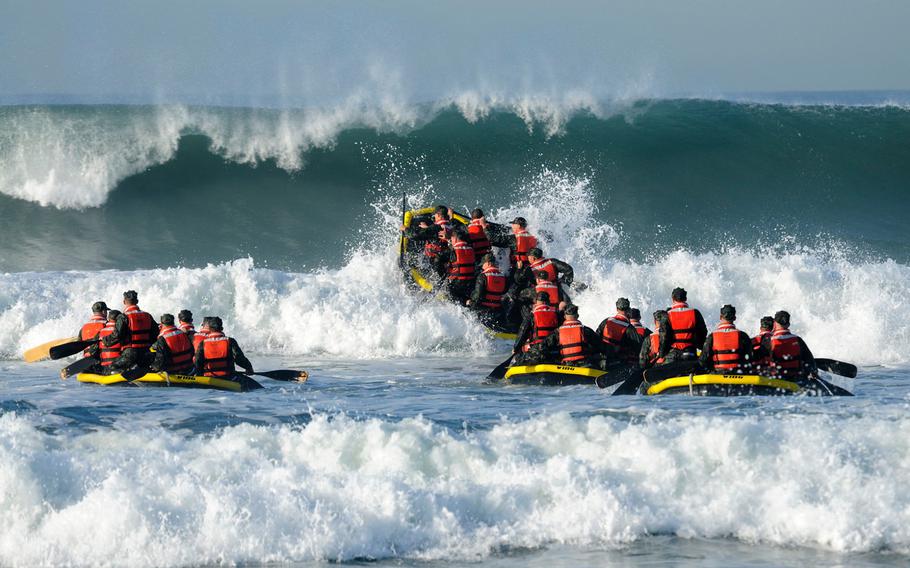Basic Underwater Demolition/SEAL students participate in Surf Passage at Naval Amphibious Base Coronado, on Feb. 16, 2010. According to reports Friday, July 21, 2017, female candidates are vying for two elite special operations jobs previously closed to women.