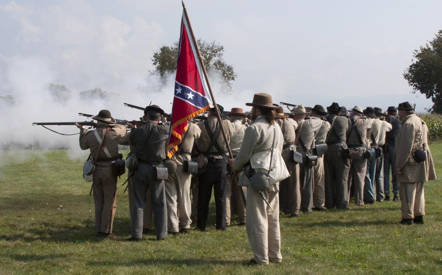 Civil War reenactors fire their rifles during ceremonies marking the 150th anniversary of the Antietam National Cemetery, Sept. 16-17, 2017 at Sharpsburg, Md.