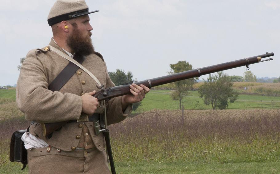 A Civil War renactor with a rifle during ceremonies marking the 150th anniversary of the Antietam National Cemetery, Sept. 16-17, 2017 at Sharpsburg, Md.