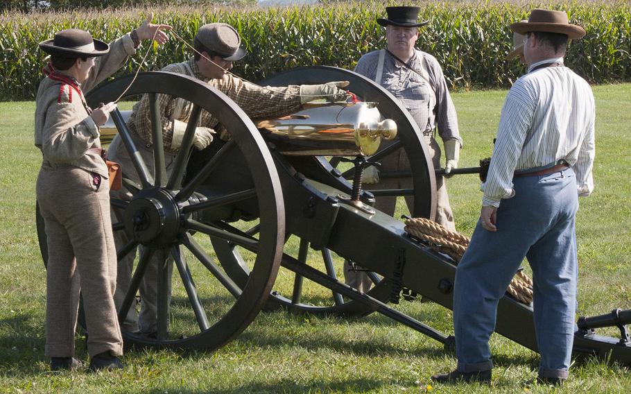 Reenactors prepare to fire a cannon during ceremonies marking the 150th anniversary of the Antietam National Cemetery, Sept. 16-17, 2017 at Sharpsburg, Md.