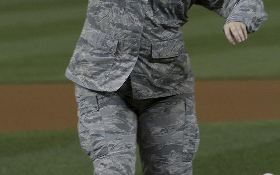 U.S. Air Force Maj. Jordan Lindeke, who received the Purple Heart for injuries sustained in a suicide bombing in Afghanistan in 2010, throws the ceremonial first pitch on U.S. Air Force Night at Nationals Park in Washington, D.C., Sept. 17, 2017.