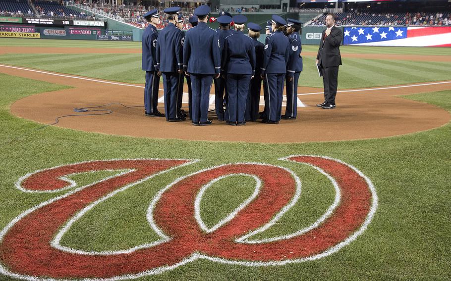 The U.S. Air Force Singing Sergeants prepare to perform the national anthem on Air Force Night at Nationals Park in Washington, D.C., Sept. 17, 2017.