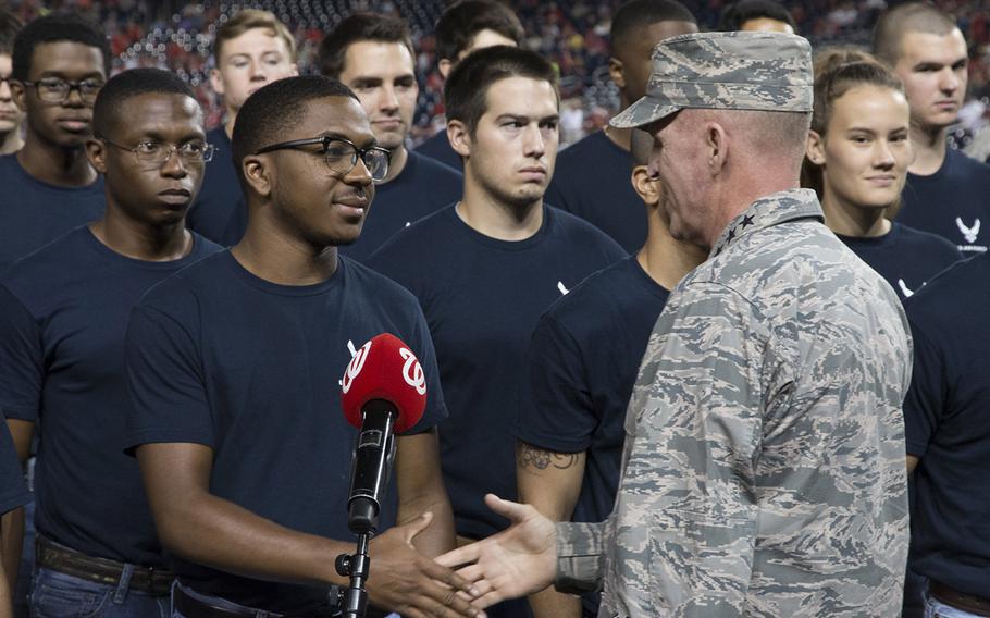 Gen. Stephen Wilson, vice chief of staff of the U.S. Air Force, congratulates the 46 recruits who just took the Oath of Enlistment on Air Force Night at Nationals Park in Washington, D.C., Sept. 17, 2017.