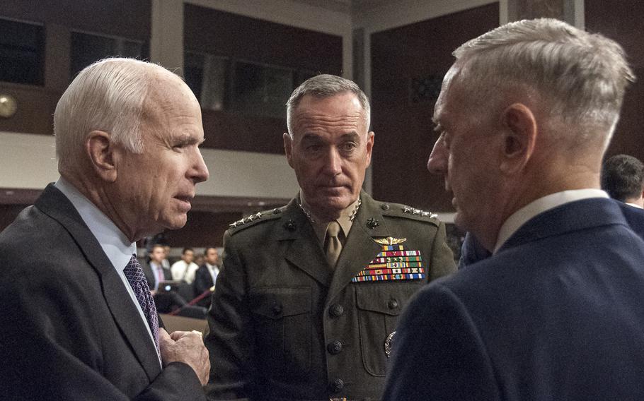 Chairman of the Senate Armed Services Committee, Sen. John McCain, R-Ariz., speaks with Chairman of the Joint Chiefs of Staff Gen. Joseph Dunford and Secretary of Defense Jim Mattis prior to the start of a hearing Tuesday, Oct. 3, 2017, on Capitol Hill in Washington.