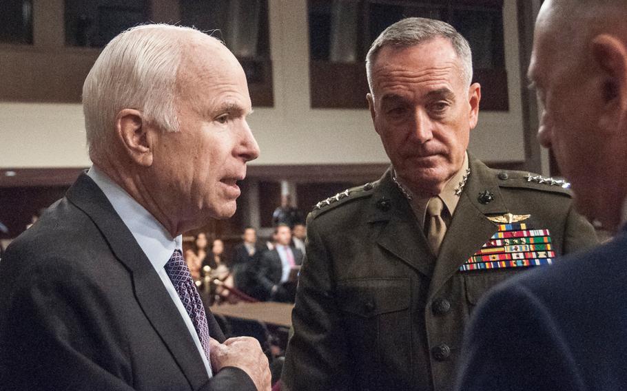 Chairman of the Senate Armed Services Committee, Sen. John McCain, R-Ariz., speaks with Chairman of the Joint Chiefs of Staff Gen. Joseph Dunford and Secretary of Defense Jim Mattis prior to the start of a hearing Tuesday, Oct. 3, 2017, on Capitol Hill in Washington. During the hearing, McCain told the two military leaders, “We want to be your partners. But this committee will not be a rubber stamp for any policy or president."