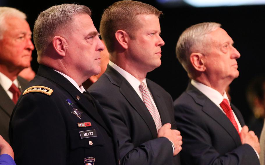 Army Chief of Staff Gen. Mark Milley, left, acting Secretary of the Army Ryan McCarthy and Defense Secretary Jim Mattis stand for the playing of the national anthem during the opening ceremony of the 2017 Association of the U.S. Army Meeting and Exposition held in Washington, D.C., on Oct. 9, 2017.