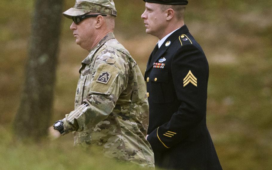 Army Sgt. Bowe Bergdahl, right, arrives for a motions hearing on Monday, Oct.16, 2017, on Fort Bragg.