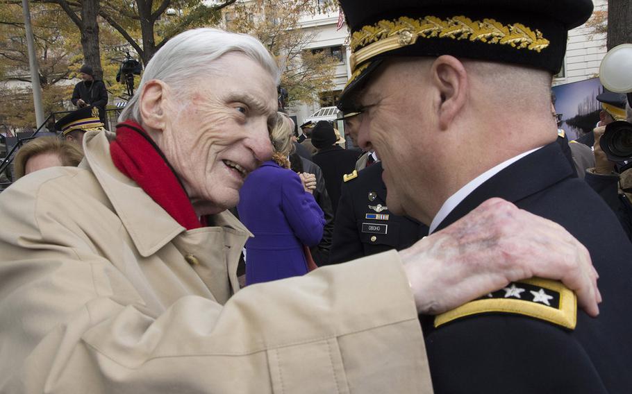 Former Sen. John Warner, R-Va., talks with Army Chief of Staff Gen. Mark Milley after the groundbreaking ceremony for the National World War I Memorial at Pershing Park in Washington, D.C., Nov. 9, 2017.