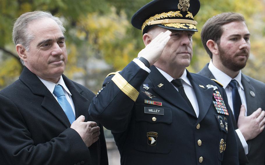 VA Secretary David Shulkin, Army Chief of Staff Gen. Mark Milley and lead designer Joseph Weishaar stand for the playing of the national anthem during the groundbreaking ceremony for the National World War I Memorial at Pershing Park in Washington, D.C., Nov. 9, 2017.
