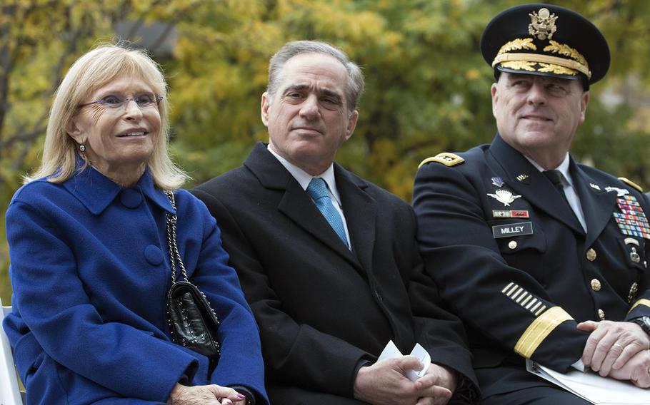 Sandra Sinclair Pershing, a family member of Gen. John "Black Jack" Pershing, listens to a speaker along with VA Secretary David Shulkin and Army Chief of Staff Gen. Mark Milley during the groundbreaking ceremony for the National World War I Memorial at Pershing Park in Washington, D.C., Nov. 9, 2017.