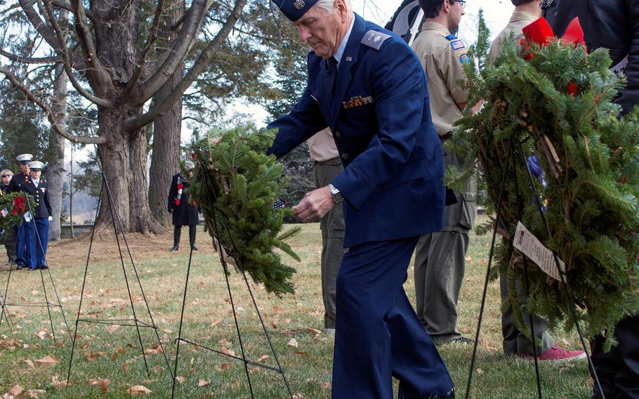 Gary Gourley Sr. of the West Virginia Wing of the Civil Air Patrol, Martinsburg Squadron, representing the Air Force, places a wreath during the opening ceremony of Wreaths Across America at Antietam National Cemetery in Sharpsburg, Md., December 16, 2017.