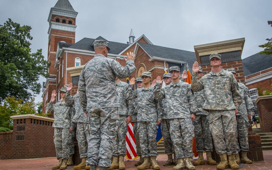 U.S. Air Force Gen. John “Jay” Raymond, commander of Air Force Space Command and the highest ranking officer to graduate from Clemson University's Reserve Officers' Training Corps program, administers the Oath of Enlistment to a group of Army ROTC cadets in Clemson's Military Heritage Plaza, Aug. 31, 2017.
