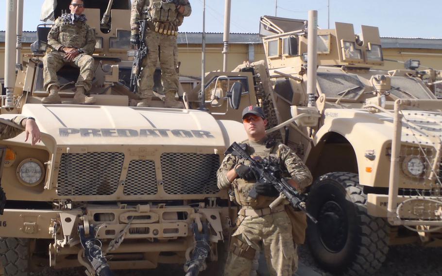 Former Army combat medic Dennis Magnasco, right, is shown in Afghanistan with other soldiers. Magnasco, who now works in the office of Rep. Seth Moulton, D-Mass., is putting out the call for gun reform along with other combat veterans.