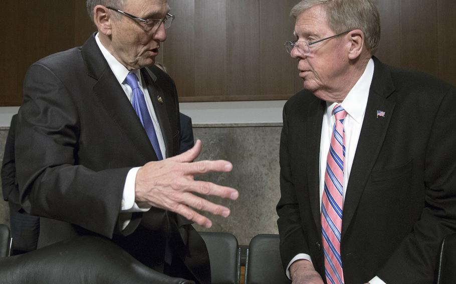 House Veterans' Affairs Committee chairman Phil Roe, R-Tenn., left, talks with his Senate counterpart, Johnny Isakson, R-Ga., before a joint hearing with several veterans' service organizations on Capitol Hill, March 6, 2018.