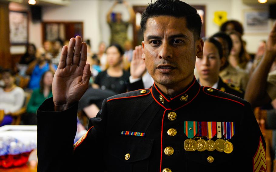 U.S. Marine Corps Staff Sgt. Martin Alonso Balcazar swears the oath of allegiance during a U.S. Naturalization Ceremony Aug. 17, 2016, at Kadena Air Base, Japan.