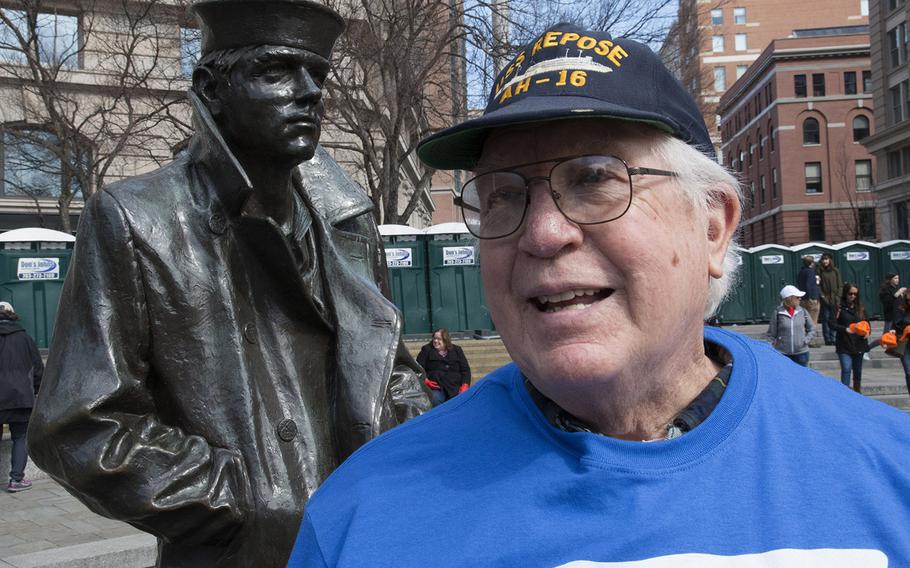 Navy veteran Richard Roberson, 71, of Hot Springs, Va., stands next to the Lone Sailor statue at the U.S. Navy Memorial in Washington, D.C., before the March for Our Lives on March 24, 2018.

