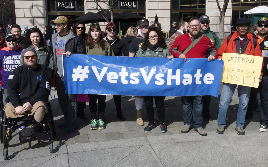 Veterans pose for a photo at the March for Our Lives in Washington, D.C. on March 24, 2018.
