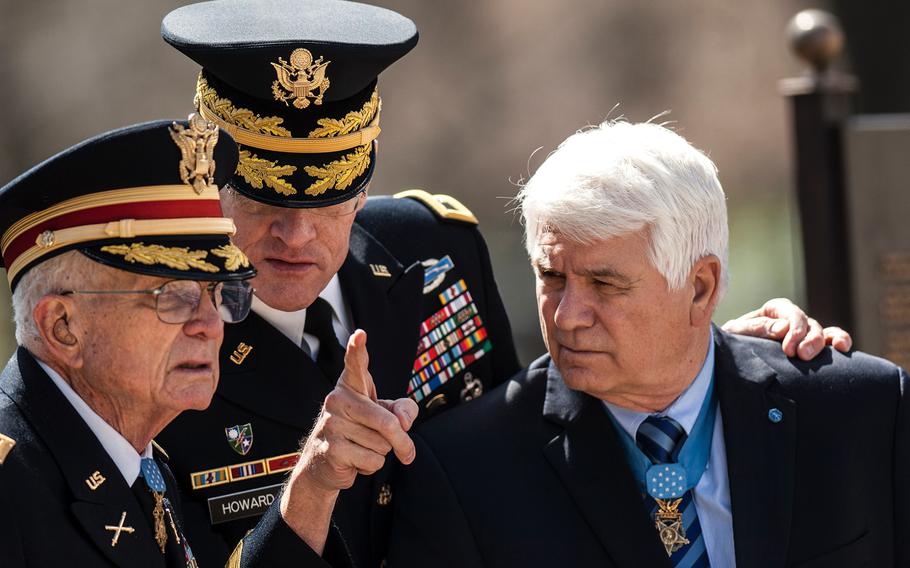 Maj. Gen. Michael Howard gives instructions to Medal of Honor recipients Charles Kettles, left, and James McCloughan before the start of a wreath laying ceremony at Arlington National Cemetery's Tomb of the Unknowns on Friday, March 23, 2018. Kettles and McCloughan were among more than two dozen MOH recipients who attended the commemorative event, which was part of the annual National Medal of Honor Day.