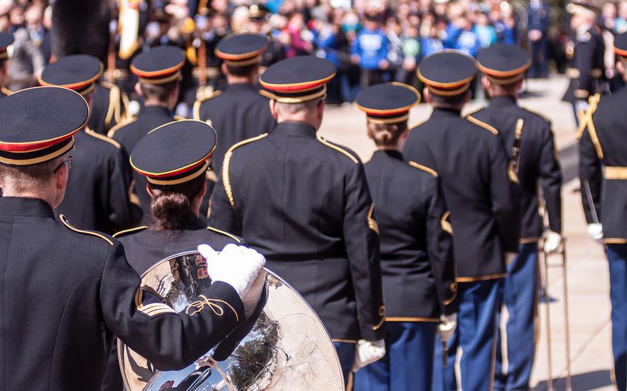 Members of the United States Army Band, "Pershing's Own," take part in a special wreath-laying ceremony at Arlington National Cemetery's Tomb of the Unknowns on Friday, March 23, 2018.