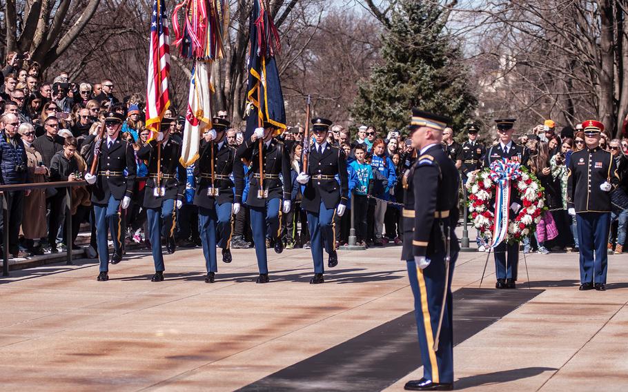 A color guard present the colors to start off a special wreath-laying ceremony at Arlington National Cemetery's Tomb of the Unknowns on Friday, March 23, 2018. More than two dozen Medal of Honor recipients observed the event.