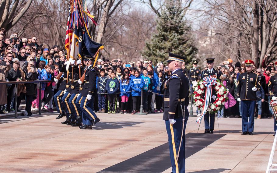 A color guard present the colors to start off a special wreath-laying ceremony at Arlington National Cemetery's Tomb of the Unknowns on Friday, March 23, 2018. More than two dozen Medal of Honor recipients observed the event.