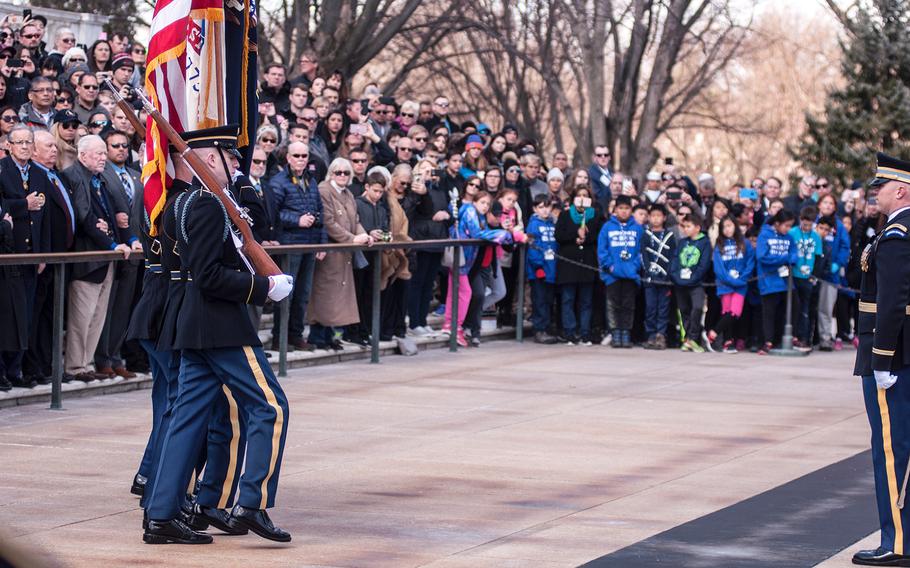 A color guard presents the colors to start off a special wreath-laying ceremony at Arlington National Cemetery's Tomb of the Unknowns on Friday, March 23, 2018. More than two dozen Medal of Honor recipients observed the event.