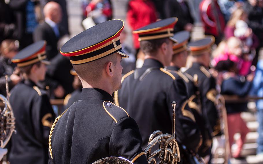 Members of the United States Army Band, "Pershing's Own," take part in a special wreath-laying ceremony at Arlington National Cemetery's Tomb of the Unknowns on Friday, March 23, 2018.
