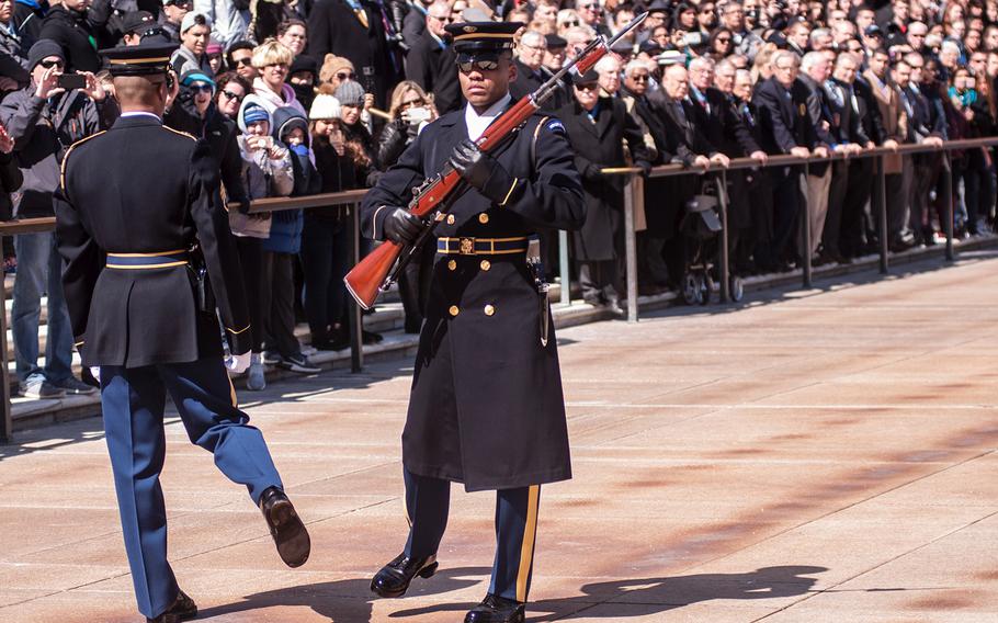 Ceremonial Army guards perform a change-of-the-guard routine before the start of a special wreath-laying ceremony at Arlington National Cemetery's Tomb of the Unknowns on Friday, March 23, 2018. More than two dozen Medal of Honor recipients, taking part in events to commemorate National Medal of Honor Day, were among a crowd of onlookers observing the ritual.