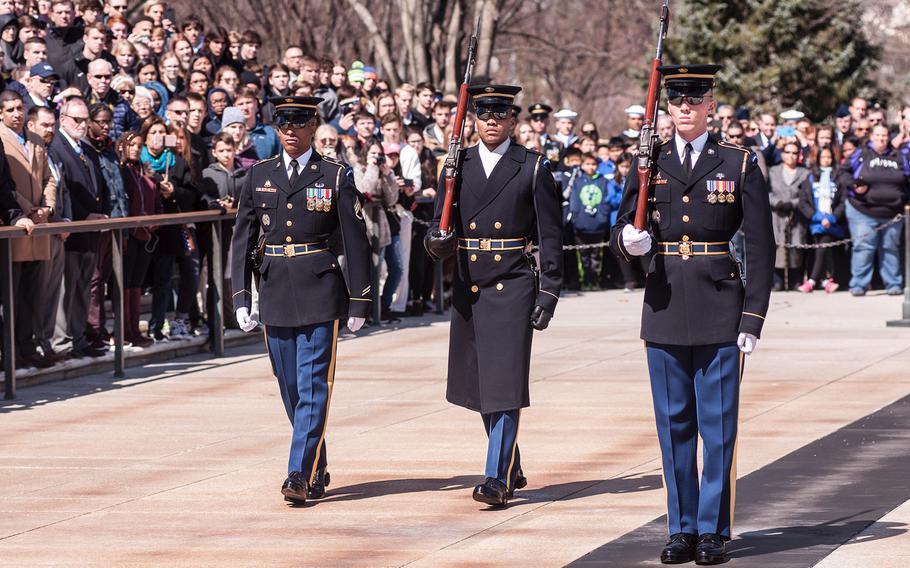 Ceremonial Army guards perform a change-of-the-guard routine before the start of a special wreath-laying ceremony at Arlington National Cemetery's Tomb of the Unknowns on Friday, March 23, 2018. More than two dozen Medal of Honor recipients, taking part in events to commemorate National Medal of Honor Day, were among a crowd of onlookers observing the ritual.