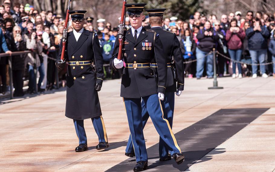 Ceremonial Army guards perform a change-of-the-guard routine before the start of a special wreath-laying ceremony at Arlington National Cemetery's Tomb of the Unknowns on Friday, March 23, 2018. More than two dozen Medal of Honor recipients, taking part in events to commemorate National Medal of Honor Day, were among a crowd of onlookers observing the ritual.