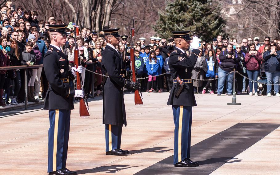 Ceremonial Army guards perform a change-of-the-guard routine before the start of a special wreath-laying ceremony at Arlington National Cemetery's Tomb of the Unknowns on Friday, March 23, 2018. More than two dozen Medal of Honor recipients, taking part in events to commemorate National Medal of Honor Day, were among a crowd of onlookers observing the ritual.