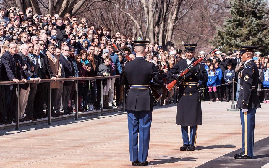 Ceremonial Army guards perform a change-of-the-guard routine before the start of a special wreath-laying ceremony at Arlington National Cemetery's Tomb of the Unknowns on Friday, March 23, 2018. More than two dozen Medal of Honor recipients, taking part in events to commemorate National Medal of Honor Day, were among a crowd of onlookers observing the ritual.