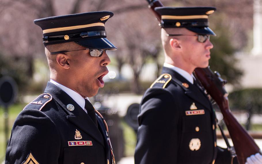 Ceremonial Army guards perform a change-of-the-guard routine before the start of a special wreath-laying ceremony at Arlington National Cemetery's Tomb of the Unknowns on Friday, March 23, 2018. More than two dozen Medal of Honor recipients, taking part in events to commemorate National Medal of Honor Day, were among a crowd of onlookers observing the ritual.