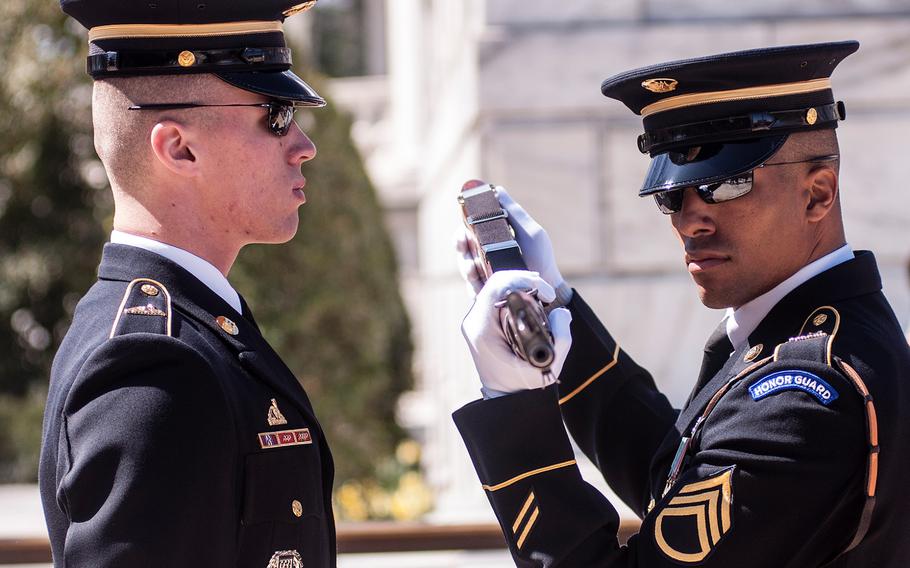 Ceremonial Army guards perform a change-of-the-guard routine before the start of a special wreath-laying ceremony at Arlington National Cemetery's Tomb of the Unknowns on Friday, March 23, 2018. More than two dozen Medal of Honor recipients, taking part in events to commemorate National Medal of Honor Day, were among a crowd of onlookers observing the ritual.