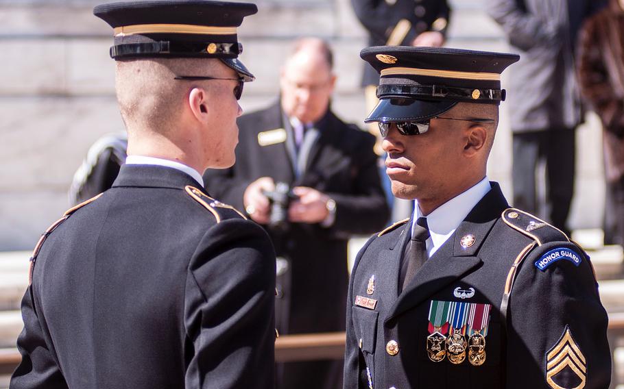Ceremonial Army guards perform a change-of-the-guard routine before the start of a special wreath-laying ceremony at Arlington National Cemetery's Tomb of the Unknowns on Friday, March 23, 2018. More than two dozen Medal of Honor recipients, taking part in events to commemorate National Medal of Honor Day, were among a crowd of onlookers observing the ritual.